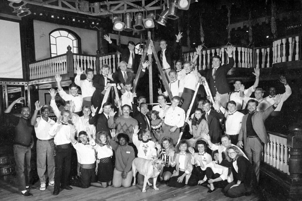 Historic Christmas card featuring Seville Quarter owners, The Mitchell Family, and staff in Phineas Phogg’s in Downtown Pensacola